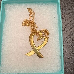 Paloma Picasso for Tiffany and Company, 18 Karat gold  “Loving Heart” necklace.
